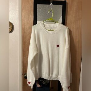 White Sweater with Red Heart Detail